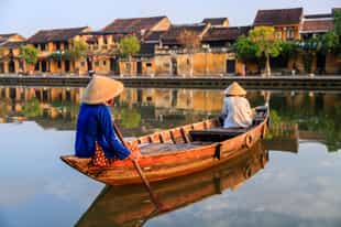 Take a boat ride up the Thu Bon River