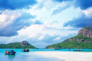 Go on a boat trip around Con Dao's wild beaches