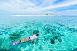 Go snorkeling in the Corals National Natural Park