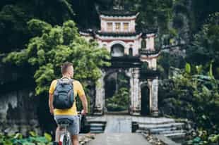 Cycle through the field to Bich Dong Pagoda temples