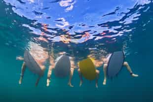 Take on the waves on a surfing lesson in Sanur