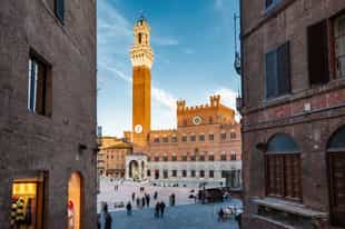 Visit the shell-shaped Piazza del Campo in Siena