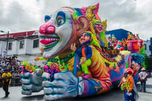 Follow giant carrozas through Pasto's streets