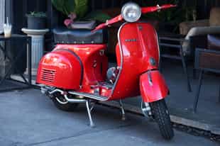 Take an evening tour of Chiang Mai by vespa