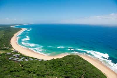 Walk along the shoreline of Ponta Do Ouro