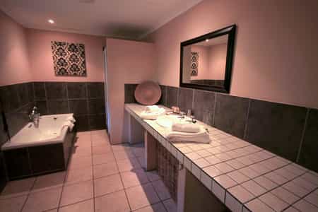 Big bathroom with separate shower and bath tub.