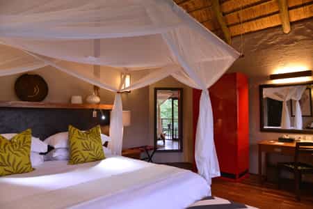 Master bedroom upstairs with bathroom en suite (with a walk-in rainfall shower), vanity unit, floor-to-ceiling sliding doors and balcony. Telephone and room safe. 1 en-suite bedroom downstairs (with a bath and rainfall shower) and a room safe.