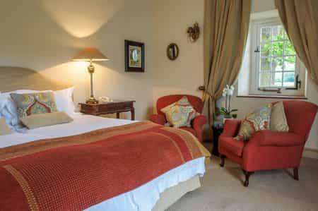 This lovely room is one of two standard twins. It can also be made into a standard double. This spacious room has a beautiful painted ceiling and en suite bathroom with separate bath & shower, plus his & hers basins.