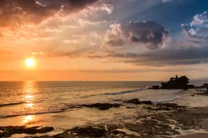 Take a scenic cycle to Tanah Lot temple for sunset