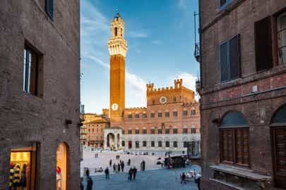 Visit the shell-shaped Piazza del Campo in Siena